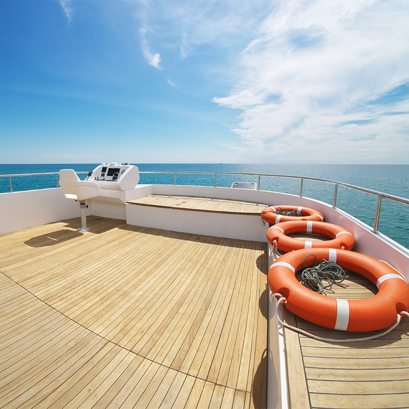 A series of life rings on the upper decking of a yacht